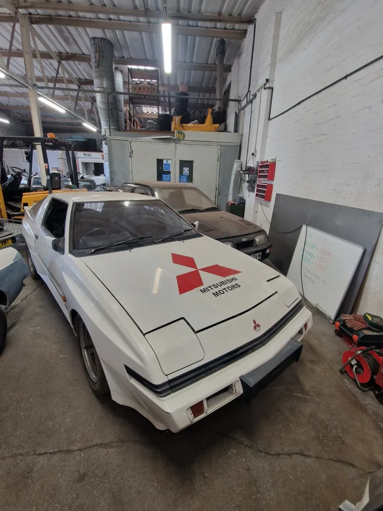 Classic Mitsubishi with red logo indoors