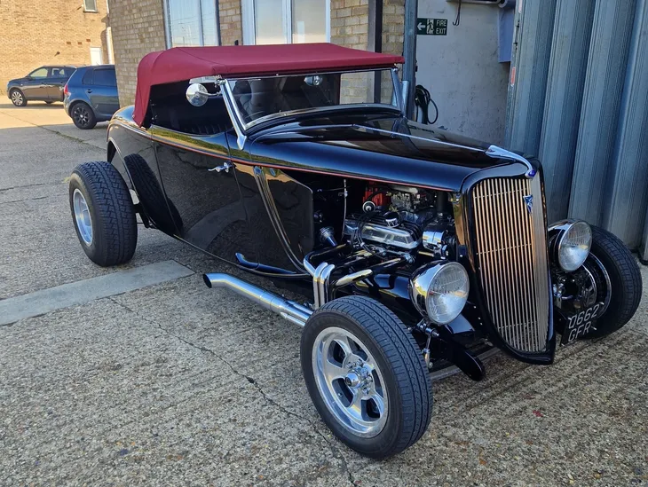 Vintage black hot rod with red roof